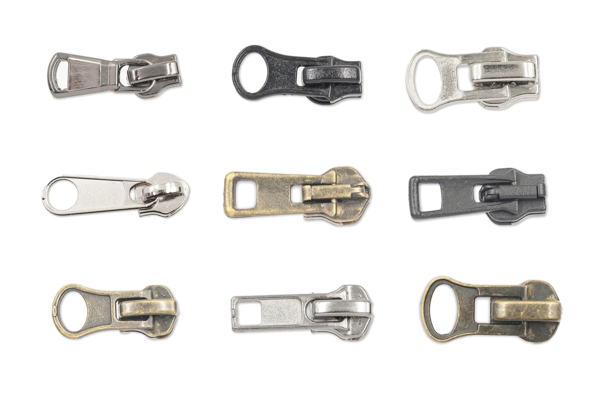 Metal zipper puller collection. Various types of zip sliders isolated on white background.